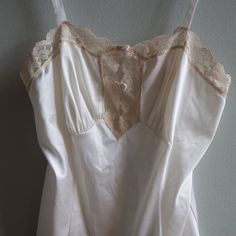 Gorgeous Vintage Camisole, Size 32 With Original Tag. Pretty Button Detail And Adjustable Straps. 100% Antron Nylon Made In Usa Machine Wash Gentle Tumble Dry Low White Camisole Tank Top For Daywear, Classic White Tank Top For Daywear, Fitted Feminine Cream Camisole, Feminine Fitted Camisole For Daywear, White Lace Trim Tank Top For Daywear, Fitted Camisole Sleep Tops, Classic White Sleeveless Camisole, Fitted Sleep Camisole Top, Sleeveless Coquette Tops For Daywear