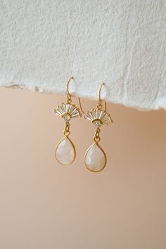 Our Aria Moonstone Earrings are simply beautiful. Made with genuine rainbow moonstone, they're made to stand out. They were designed for the classic, yet bohemian chic bride who wants a dainty look on her wedding day.FEATURES Genuine Rainbow Moonstone Teardrop set in gold vermeil or sterling silver Choice of Materials: 16k gold, rose gold, or sterling silver Ear wire is sterling silver or gold filled 100% nickel free, great for sensitive ears Dainty Moon Charm Wedding Jewelry, Dainty Moon Charm Jewelry For Wedding, Teardrop Gemstone Chandelier Earrings For Wedding, Elegant Wedding Moonstone Earrings, Delicate Gemstone Earrings For Wedding, Delicate Gemstone Drop Earrings, Bohemian Dangle Crystal Earrings For Wedding, Wedding Chandelier Earrings With Gemstones, Wedding Chandelier Dangle Earrings With Gemstones