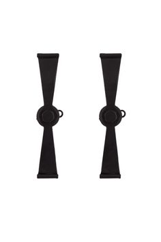 two black candlesticks sitting next to each other