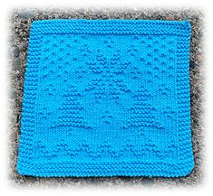 a blue knitted dishcloth on the ground