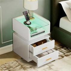 a night stand with two drawers and a phone on top