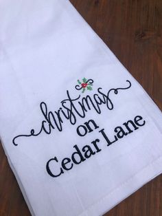 a white towel with the words christmas on cedar lane