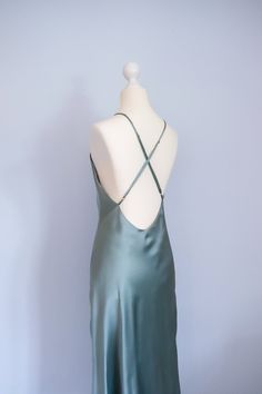 Size: XS - Bust 77 - 79cm - Waist 60 - 62cm - Hip 83 - 85cm - Front length without straps 105cm - color: mystical green   - very simple yet classy and elegant evening dress - wide open back design with adjustable straps - bias-cut design allows the beautiful flare and nuances  - a perfect addition for your minimalistic, refined wardrobe - 100% handmade in Germany with care and adoration, supporting you to uplift your energy and self-loving consciousness Made with 100% mulberry silk charmeuse - Grade 6A - Mulberry silk - 19 momme - OEKO-TEX® certified material Wash care information - Dry cleaning - Cool hand wash - Iron on reverse side - Do not bleach - No tumble dry -No fabric softner Silk Low-back Slip Dress For Summer, Silk Summer Slip Dress With Low Back, Summer Silk Slip Dress With Low Back, Fitted Satin Slip Dress With Low Back, Green Wedding Dress With Back Opening, Green Satin Summer Evening Dress, Green Silk Evening Slip Dress, Green Silk Slip Dress For Evening, Silk Bias Cut Backless Slip Dress