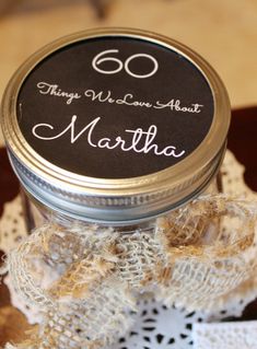 there is a small jar with some type of label on it that says 60 things we love about martha