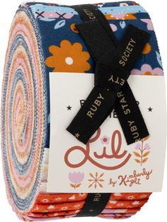 a roll of fabric with an image of flowers on it and a tag that says, happy