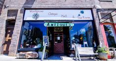 the outside of an antique store with wooden steps leading up to it's entrance