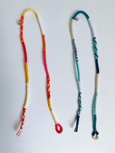 three different types of lanyards on a white surface