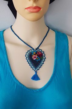 Hello. These are the products that I have worked diligently for you with my own handiwork in Turkey. The necklace, which carries ethnic influences from Turkey, is decorated with artificial silk needle lace flowers and can be washed with warm water. The design is made on denim fabric. I knitted the cord of the necklace from cotton thread. There are other models on my page, you can examine this beautiful art created by knotting with a needle, I hope you like it. The most elegant gift for wife and Bohemian Necklaces For Mother's Day, Handmade Heart-shaped Jewelry For Festivals, Artisan Decorative Necklaces For Gifts, Bohemian Necklace With Flower Pendant As Gift, Artisan Necklace With Decorative Details As Gift, Artisan Decorative Necklace For Gifting, Artisan Decorative Necklace For Gifts, Bohemian Flower Pendant Necklace As Gift, Unique Decorative Necklace For Gifts