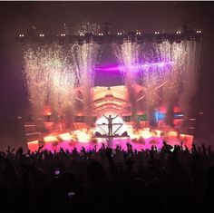 the stage is lit up with colorful lights and fireworks