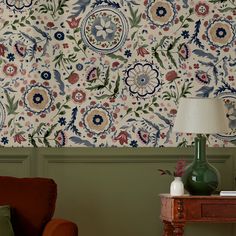 a living room scene with focus on the table and wallpapered walls behind it