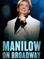 the manlow on broadway poster has a microphone in his hand and is wearing a white suit