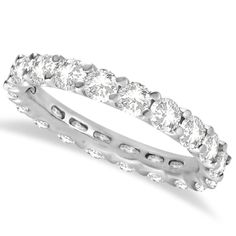 a white gold ring with three rows of round cut diamonds on the inside and outside