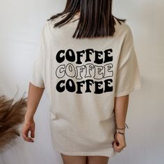 "C O F F E E ∙ S L O G A N∙ T E E    * Funky, bubble writing \"Coffee Coffee Coffee\" slogan t-shirt. Available in white, sand, pink light blue & dark blue. Perfect for an oversized, lounge vibe M A T E R I A L   * 100% pure cotton    * Specialty spun fibres provide a smooth surface for vivid, premium print   * Made without side seams, for maximum comfort    * The shoulders have tape for improved durability   Y O U R ∙ O R D E R *  Packaged with care *  Please message me with any questions or re Cute Shirt Sayings For Women, Casual Coffee Slogan T-shirt, Casual Coffee Colored Slogan T-shirt, Casual Coffee T-shirt With Slogan, Trendy Coffee Colored Relaxed Fit T-shirt, Casual Coffee T-shirt With Letter Print