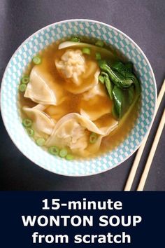 a bowl filled with dumplings and vegetables next to chopsticks