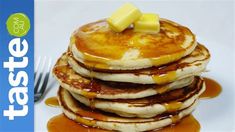 a stack of pancakes with syrup and butter on top