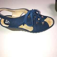 Fly London Ylfa Blue Leather Lace Up Sandals 41/10-10.5. Peep Toe, Lace-Up Design With D-Ring Hardware, Ankle Strap, Cutouts On Sides Padded Insole, Textured Outsole Approximate Measurements: Wedge Heel 2-1/4"H; Platform 3/4"H Leather Upper/Lining; Man-Made Balance Fly London Shoes, London Shoes, Fly London, Lace Up Sandals, London Blue, Leather Lace, D Ring, Blue Leather, Leather And Lace