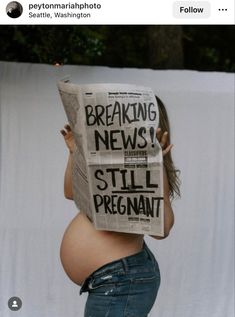 a pregnant woman reading a newspaper with the caption breaking news still pregnant