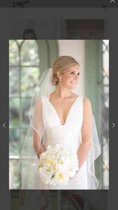 a woman in a wedding dress holding a bouquet