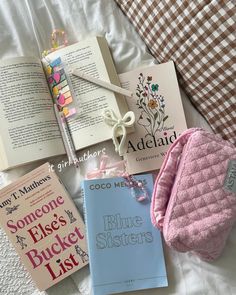 there are many books on the bed together