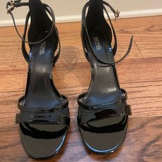 Pristine Condition. Never Worn Outside! Black Patent Leather Heels. About 3 Inches Heel Height. Size 9. Michael Kors 4-inch Heel Synthetic Heels, Elegant Michael Kors Heels For Night Out, Michael Kors Ankle Strap Heels For Evening, Michael Kors Heels With Heel Strap, Michael Kors Formal Synthetic Sandals, Formal Michael Kors Synthetic Sandals, Chic Black Michael Kors Sandals, Michael Kors Elegant Synthetic Heels, Elegant Michael Kors Heels With Reinforced Heel