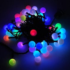 a bunch of lights that are on top of a black surface with some wires attached to it