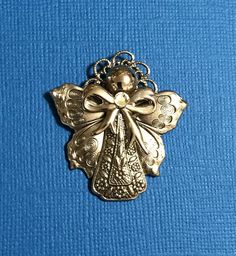 Guardian Angel Pin #213  This elegant angel pin with butterfly wings is a favorite.  Available bright gold or antique silver finish.   Size: 1 1/2"x 1 1/2"  #angel Angel Wings-shaped Jewelry As Gift, Angel Wings Locket Necklace, Angel Brooch, Brooch Jewelry