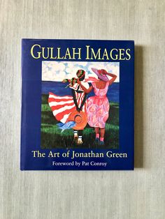 the book gullah images by jonathan green is sitting on top of a table