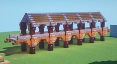 an image of a wooden bridge made out of lego blocks in minecraft with grass and blue sky