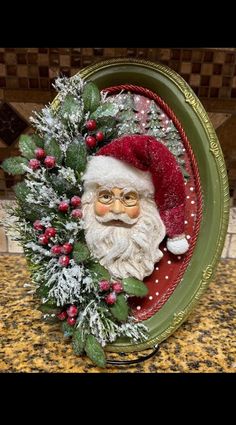 a christmas wreath with santa claus in it