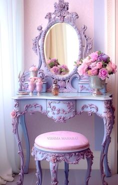 a pink vanity and stool with flowers on it