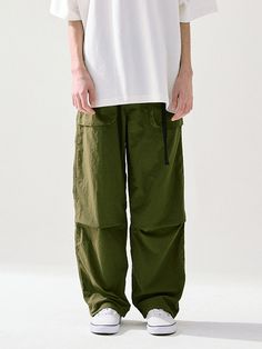 This is a casual and comfortable pants that are made out of high quality nylon 100% fabric. With design detail of crunchy texture of the fabric, adjustable banding and belt on the waist, and string and stopper on the hem, it gives a trendy and casual mood.- Water resistant fabric- Adjustable waistband with elastic band and belt- Pleats detail on the knee- String and stopper on the hem Green Straight Parachute Pants With Belt Loops, Green Wide Leg Nylon Cargo Pants, Casual Wide-leg Parachute Pants With Belt Loops, Green Wide-leg Nylon Cargo Pants, Relaxed Fit Parachute Pants With Belt Loops, Casual Nylon Pants With Belt Loops, Casual Nylon Wide-leg Pants, Casual Wide-leg Nylon Pants, Summer Utility Parachute Pants With Belt Loops