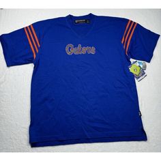 Uf Gators T-Shirt Women's Xl Top Collegiate Fashionista Diane Dal Lago Bling New * Width: 24" (Armpit To Armpit) * Length: 29" (Shoulder To Bottom) * Blue & Orange V-Neck With Stripes On Sleeves * Please Use The Measurements To Make Sure This Shirt Will Work For You Orange Short Sleeve T-shirt For Game Day, Casual Orange Tops For Game Day, Sporty Orange Tops For Game Day, Blue Retro Sports T-shirt, Blue Casual Tops For Game Day, Retro Blue T-shirt For College, Casual Orange College Tops, Casual Orange Tops For College, Blue Sports Fan Tops For College