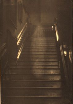 an old photo of some stairs in a building