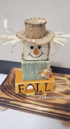 a wooden block with a snowman on it