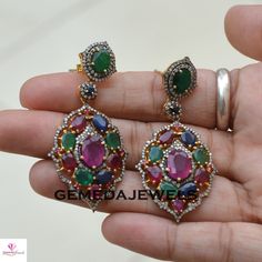 Ruby Gemstone Earrings, Emerald Silver Earrings, Pave Diamond Earrings, Sapphire Gemstone Jewelry, 925 Silver Gold Plated Jewelry, Gifts Gross Weight: 16.32 gram Gemstone Weight: 16.87 cts Diamond Weight: 1.90 cts Earrings Size: 54X26 MM NOTE:- All The Products Are Designed And Manufactured In My Workshop By Me & My Team. Shown Products Are Purely Handmade. Custom Orders Are Open Handly Accepted. We Are the Perfect Choice For Any Custom Jewelry Manufacturing. For Bulk Orders Please Message m Multicolor Diamond Round Earrings, Multicolor Round Diamond Earrings, Multicolor Diamond Gemstone Earrings, Diamond Multi-stone Earrings For Anniversary, Round Multi-stone Earrings For Anniversary, Fine Jewelry Multi-stone Diamond Earrings For Gift, Multi-stone Cubic Zirconia Round Earrings, Multi-stone Cubic Zirconia Earrings, Pendant Earrings Hand Set As Gift