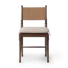 a wooden chair with a beige seat and back cushion on the side, against a white background