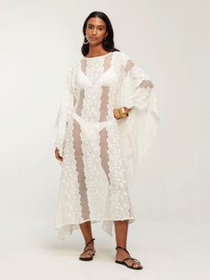 Introducing our Coumba Dress in Bijour Blanc, a stunning addition to your resort wardrobe. Crafted from 100% cotton eyelet with floral appliqué, this flowy caftan-style dress boasts a versatile midi length and can be effortlessly styled as a beach cover-up or paired with a slip dress for a chic daytime look. Flowy caftan Midi length Not lined Can be worn as a beach cover-up with a swimsuit or with a slip dress underneath. 100% cotton SIZINGSizes XS/S to 3XLCAREMachine wash cold with similar colo Resort Wardrobe, Floral Applique, Beach Covers, Midi Length, Custom Color, Slip Dress, Cover Up, Wardrobe, Fashion Dresses