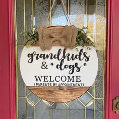 a welcome sign hangs on the front door