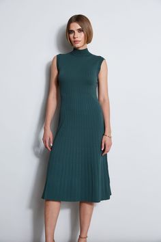 Our Mock Neck Midi Dress is an elevated take on the knit dress trend. Featuring a Fit & Flare silhouette & pointelle rib stitch, this ultra-versatile dress can be easily dressed up with heels or down with sandals. Our Knit Midi Dress is a seasonless must have! Elie Tahari Exclusive Stretch Rib Knit Fit & Flare Midi Dress 67% Rayon, 28% Nylon, 5% Elastane Runs True to Size Model is wearing size 2 Dry Clean Only Imported Style #: E7522604 Mock Neck Midi Dress, Rib Stitch, Mock Neck Dress, Versatile Dress, Long Sleeve Short Dress, Elie Tahari, Versatile Dresses, Knit Midi, Knit Midi Dress