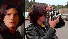 two people are taking pictures with their cell phones and one is wearing a leather jacket