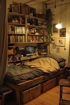 an unmade bed sitting in the middle of a room with lots of bookshelves