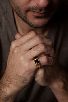 Bold and so rich looking, this 14k gold men’s ring features a faceted genuine black onyx gemstone as its focal point. The wide band adds to its boldness and it slightly tapers in the back for comfort. I gently brush the gold for added texture, plus it works so well with the black onyx stone. The black onyx measures 8mm x 8mm. Comes in a handsome black alligator print gift box. FREE shipping worldwide. Handmade in Israel.✦ Handmade in real 14k gold.✦ Genuine black onyx gemstone. ✦ Comes in a gift Black Onyx Ring Gold, Guy Jewelry, Large Gold Ring, Man Rings, Stone Rings For Men, Onyx Ring Men, Mens Wedding Bands Unique, Boyfriend Valentines, Unique Mens Rings