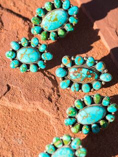 A beautiful mix of Royston, Piolet Mountain and Sonoran gold cluster rings! No words needed here to describe these amazing works of art. Big bold Royston NV turquoise, Native made for Brit West. Available in Green or Blue. On solid sterling silver. These look great with our cluster pendants, and when ordered together we make sure to match them. Pendants shown on our braided leather necklaces or 5 strand Navajo pearls! We can build these in bigger Mas Grande sizes as well. Contact us for pic of c Braided Leather Necklace, Royston Turquoise, Cluster Pendant, Kingman Turquoise, Turquoise Rings, Braided Leather, Beaded Rings, Cluster Ring, Leather Necklace