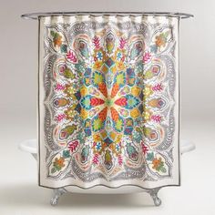 a colorful shower curtain with an intricate design on the front and back side, hanging from a metal rod