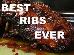 ribs covered in bbq sauce on top of a cutting board with the words best ribs ever