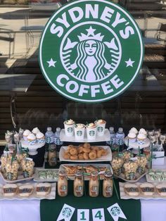 the table is full of snacks and drinks for starbucks's coffee shoppers to enjoy