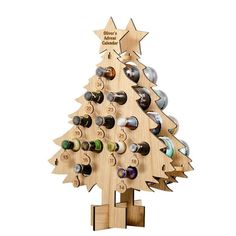 a wooden christmas tree with wine bottles in it