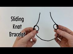 two hands holding black string with the words sliding knot not bracelet