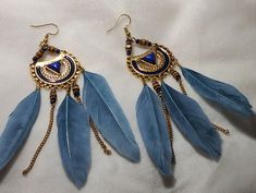 A beautiful pair of blue and gold dreamcatcher earrings with blue feathers. Howls Bedroom, Gold Dreamcatcher, Blue Dreamcatcher, Dreamcatcher Earrings, Blue Feathers, Dream Catcher Earrings, Blue Feather, Blue And Gold, Dream Catcher