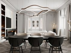 an elegant dining room with white walls and black chairs